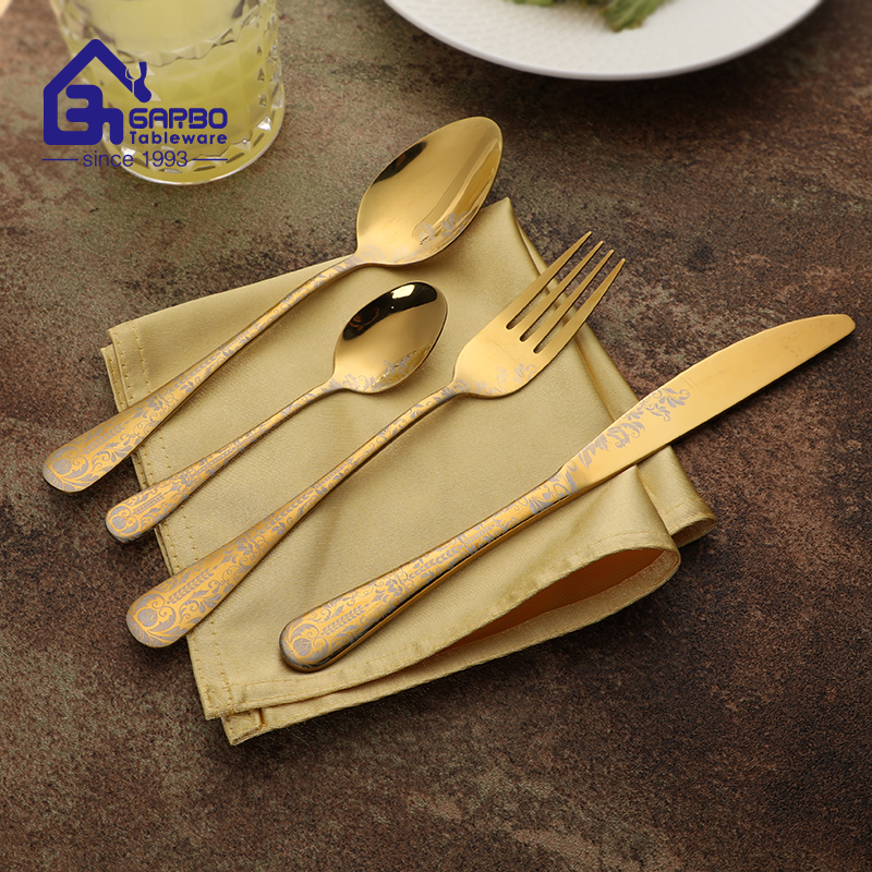 Gold 4pcs cutlery sets with laser flower design in handle 