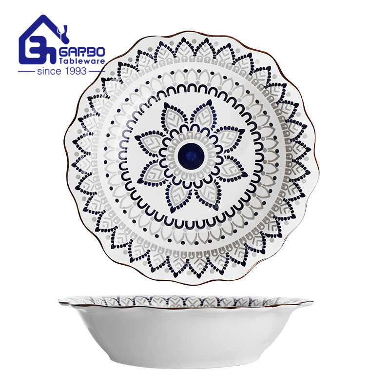 decorated ceramic bowl with flower edge