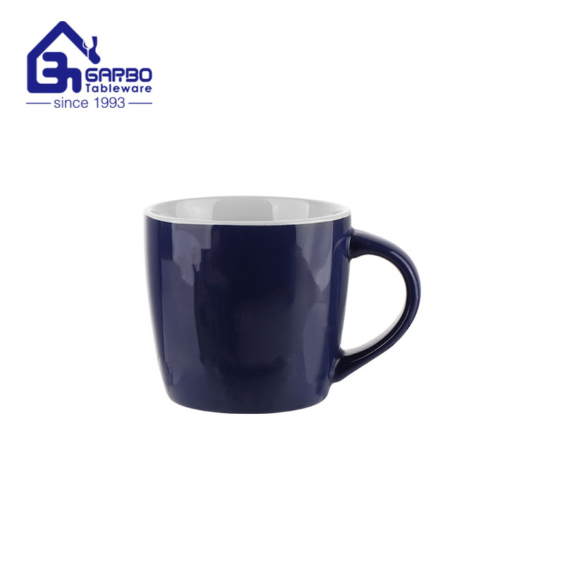 Taza de café de cerámica de color azul de 340 ml con interior blanco para uso doméstico