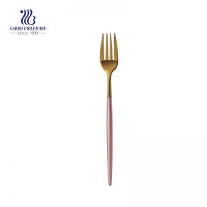 Golden stainless steel fruit fork with pink handle