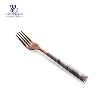 Electroplated stainless steel dinner fork with plastic handle