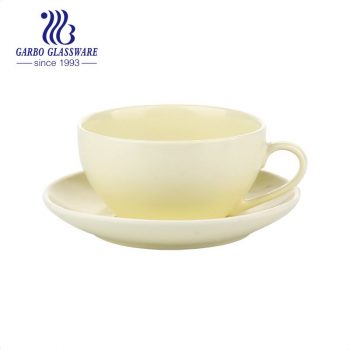 Yellow color glazed coup shape teacup and saucer set