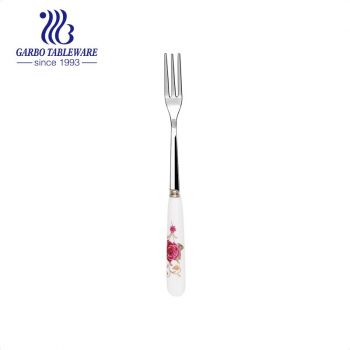 Fourchette à fruits en acier inoxydable poli miroir créatif avec poignée en céramique de conception de fleur personnalisée Couverts à salade en argent