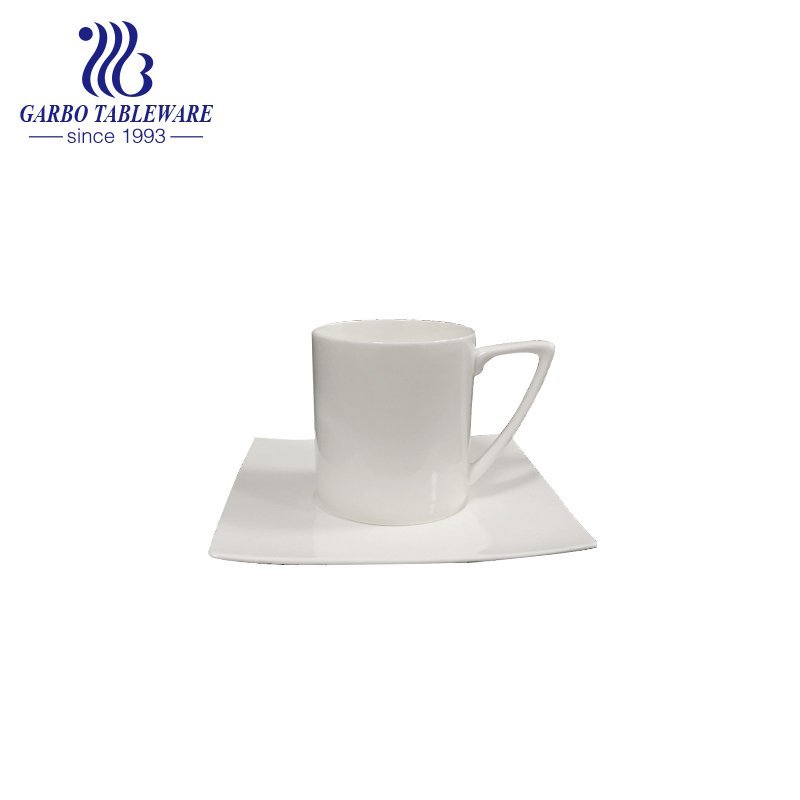 Triangle handle tea cup and saucer set with design