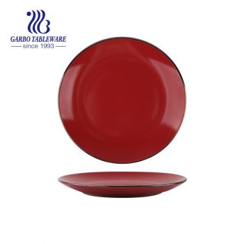 Wholesale unique red color glazed royal 10.5inch ceramic flat dinner plate with gold rim