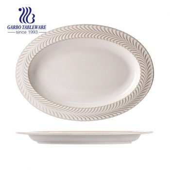 Toptan özel tasarım zarif beyaz kabartmalı tasarım ile 12.5 inç oval porselen balık tabağı