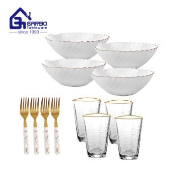 Gold rimmed white opal glass bowls with glass tumblers and gold forks